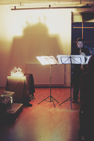 Saxophonist with illuminated sculpture